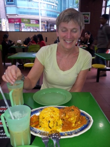 sharing a chicken and biryani dish with iced teh tarik (Indian milk tea) in Little India with Ann