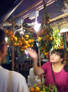 stocking up on mandarin oranges (a symbol of abundance and good fortune) to exchange with others
